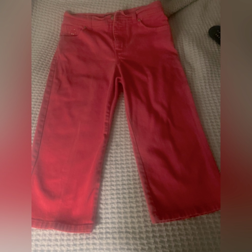 Cropped, pink jeans.